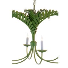 a green chandelier with three candles hanging from it's arms and leaves