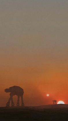 the sun is setting behind a star wars scene with two at - at walkers