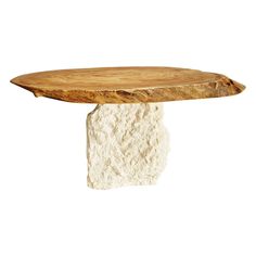 a wooden table sitting on top of a white stone block with a piece of wood sticking out of it