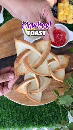 someone is holding bread in the shape of an intertwined knot