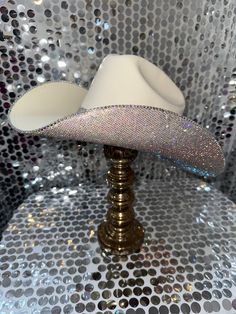 This hat features:  Sand square straw hat Ab rhinestones on the underneath brim Matching ab rhinestone hat band Ab trim on edges Sizing: Our sand hats offer sizes S/M and L/XL. We recommend the S/M if you wear a hat size of 7 1/8 or smaller (equivalent to head circumference of 57 CM or 22 1/4 inches). We suggest the L/XL if you wear a size 7 1/4 or larger (equivalent to head circumference of 58 CM or 22 1/2 inches). The band on the inside is a stretchy band; all orders come with a custom Rhinest Diamond Cowboy Hat, Cowboy Hut, Rhinestone Hat, Rhinestone Cowboy, Straw Cowboy Hat, Wearing A Hat, Hat Band, Cowboy Hat, Head Circumference