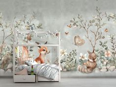 a room with a bed, dresser and wallpaper that has an animal mural on it