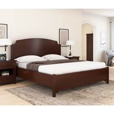 a bedroom with a bed, night stand and two nightstands on either side of the bed