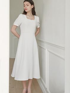 This is a minimal and feminine dress by MICANE that is made out of high quality and sturdy fabric. With trendy design detail and refined mood, you can style it for your refined and casual daily outfit.- Minimal and feminine mood- Square neckline with heart line detail- Sleeves shirring detail Classic Midi Dress With French Seams, Classic Spring Midi Dress With Square Neck, Modern Solid Color Dresses For Spring, Modern Solid Color Spring Dresses, Feminine Square Neck Dress For Work, Chic Plain Midi Dress, White Square Neck Midi Dress For Workwear, Elegant Dresses With French Seams For Daywear, Elegant Plain Midi Dress For Work