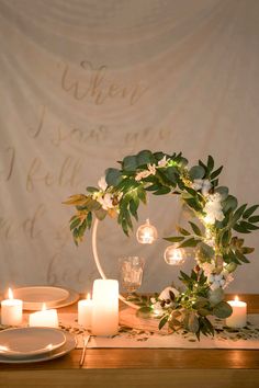 a table with candles and flowers on it