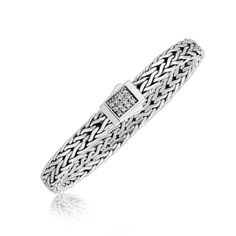 A box style lock accented with pave set white sapphires shows off the elegance of this braided men's bracelet. Crafted in fine sterling silver and available in 7 1/2 inches and 8 1/4 inches. Bracelet Information Chain Type wheat Clasp Type box-with-tongue Width 0.28 inches Setting Type prongs Avaliable Sizes 7.5 inches - 8.25 inches Metal 925 Sterling Silver Gemstone Information Stone Type White Sapphire Shape Round Formal Silver Chain Bracelet With Pave Setting, Classic Formal Bracelet With Pave Setting, Classic Formal Chain Bracelet With Pave Setting, Classic Silver Chain Bracelet With Pave Setting, Silver Chain Bracelet With Pave Setting As Gift, Silver Pave Setting Chain Bracelet As Gift, Classic Silver Chain Bracelet With Diamonds, Silver Bracelets With Pave Setting For Formal Occasions, Silver Bracelets With Pave Setting For Formal Events