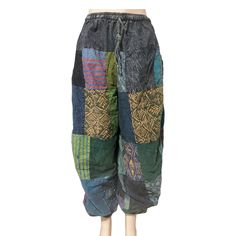 "Handmade boho patchwork pant ethically made multicolored- multi patched harem pants 100 % cotton handmade Ethical made drawstring with elastic waistband Two pocket Length 39\" Waist 22\"- 36\" Description Such a nice and colorful pants which are great as a casual wear on daily basis.Take it and enjoy its comfort either in your holidays or short breaks or even better in festivals.Adore yourself with these lovely pants while shopping or chilling with your mates.Classic hippie pants. Features Elas Bohemian Multicolor Patchwork Bottoms, Bohemian Baggy Patchwork Harem Pants, Hippie Style Patchwork Harem Bottoms, Bohemian Multicolor Patchwork Pants, Hippie Patchwork Harem Bottoms, Hippie Harem Bottoms With Patchwork, Baggy Patchwork Pants For Festival, Green Patchwork Harem Pants For Festival, Green Bohemian Pants With Patchwork