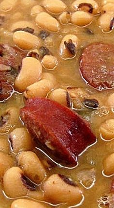 beans, sausage and other foods are in a bowl