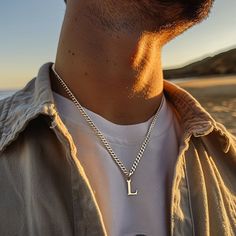 Discover the epitome of elegance and personalization with our Personalized Silver Initial Necklace - a minimalist yet profoundly meaningful piece of men's jewelry, perfect for gifting. This meticulously crafted necklace features a sleek, silver initial pendant, designed to celebrate individuality and style with a subtle, sophisticated touch. Ideal for any occasion, this necklace serves as a remarkable gift for him, whether it's for a birthday, anniversary, or just a thoughtful gesture to show yo Men’s Silver Necklace, Elegant Stainless Steel Necklace For Father's Day, Initial Pendant Jewelry With Curb Chain For Gift, Gift Jewelry With Initial Pendant And Curb Chain, Modern Curb Chain Jewelry As A Gift, Father's Day Gift Necklace With Curb Chain, Personalized Silver Minimalist Chain Necklace, Gift Necklace With Initial Pendant And Curb Chain, Classic Polished Chain Necklace Gift