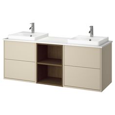 two white sinks sitting next to each other on top of a wooden cabinet under a faucet