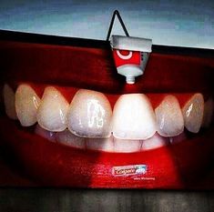 an advertisement for coca cola is shown with teeth and toothpaste on the front