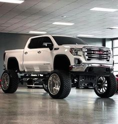 a large white truck parked in a garage