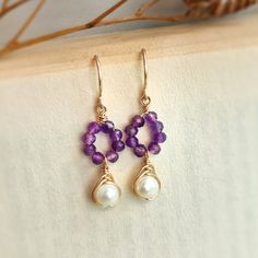 CIARA Amethyst & Pearl Dangle Earrings in 14K Gold Filled or Sterling Silver • Handmade with natural amethyst gemstones & freshwater pearls. Choices of 14K Gold filled & Sterling Silver • Drop length: 2 cm • Dainty, cute, & tiny. Perfect earrings to wear every day✨ • These earrings won’t tarnish or turn color. You can wear them every day. • Hypoallergenic. You won’t have to worry about allergies from metal such as nickel. • Each pair will be packaged in a beautiful earring card and tiny craft pa Amethyst Dangle Earrings For Jewelry Making, Purple Amethyst Jewelry With Pearl Drop, Handmade Amethyst Purple Earrings, Amethyst Dangle Earrings With Natural Stones, Handmade Amethyst Crystal Dangle Earrings, Handmade Purple Dangle Pearl Earrings, Earring Cards, Pearl Earrings Dangle, Polish Jewelry