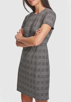 This posh A-line dress from Calvin Klein showcases a timeless houndstooth print. | Calvin Klein Women's Short Sleeve Printed A-Line Dress, 12 Elegant Plaid Dress For Spring Workwear, Elegant Spring Plaid Dress For Work, Fitted Plaid Dresses For Work, Plaid Dresses For Work, Casual Mini Dress With Houndstooth Pattern For Work, Calvin Klein Formal Dress For Fall, Knee-length Business Casual Fall Dress, Calvin Klein Fall Formal Dress, Elegant Plaid Mini Dress For Work