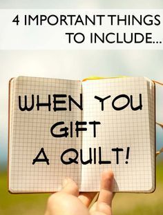 someone holding up an open notebook with the words when you gift a quilt