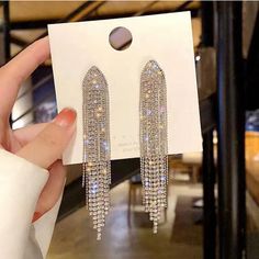 Description: 100% Brand New And High Quality. The Silver Needle Long Tassel Rhinestone Earrings Are Exquisite And Beautiful In Appearance.Silver Needle Earrings Are Not Easy To Be Allergic,So Feel Free To Wear Them.Daily Collocation Increases The Overall Beauty And Temperament,Making It More Elegant And Fashionable. Features: Material:Rhinestones,Silver Needles Color:Gold,Silver Size:Length About6cm (1 Inch =25.4mm Or 1mm = 0.0393 Inch) Package Includes: 1pair Tassel Earrings Notice: 1. Please A Shiny Earrings, Long Tassel Earrings, Fancy Earrings, Winter Formal, Tassel Drop Earrings, Tassel Jewelry, Fancy Jewellery, Girly Pictures, Red Earrings