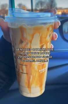 a person holding up a cup with liquid in it and the caption reads, ventti iced catmik latte 1 pump white sugar 2 pumps brown sugar caramel