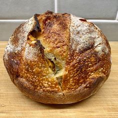 a loaf of bread sitting on top of a wooden table