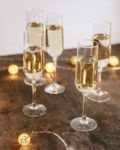 four glasses of champagne are sitting on a table