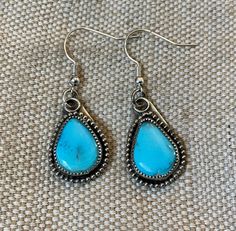 These one of a kind, handmade natural turquoise earrings are set in Sterling Silver. Handmade Southwestern Earrings For Gift, Artisan Turquoise Earrings With Natural Stones, Southwestern Style Earrings With Natural Stones For Gifts, Southwestern Natural Stone Earrings For Gifts, Artisan Turquoise Oval Earrings, Handmade Oval Turquoise Earrings, Southwestern Oval Earrings As Gift, Southwestern Oval Earrings For Gift, Unique Turquoise Teardrop Earrings