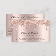 a pink and silver business card with glitter drips on the front, in white marble