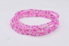 Stretch Bracelet, Stackable Bracelet, Beaded Bracelet, Stack Bracelet, Pink Bracelet, Bead Bracelet, Friendship Bracelet.  Colors in this bracelet are Pink, Lt. Pink, and Clear.  Build your own set. They can be bought in a set of 3, set of 5, or set of 8. These seed beads are 11/0 in size. All bracelets are made in a size 7, which is an average size wrist. If you need a bigger or smaller size, put it in the notes at checkout.  Care Roll on your wrist and roll off. The elastic cord is sturdy but Friendship Bracelet Colors, Beaded Bracelet Stack, Bracelet Colors, Friend Bracelet, Stack Bracelet, Color Bracelet, Note Pictures, Beach Anklets, Rose Bracelet