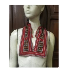 Vintage tribal red Dao women Bib. It is over 25 years and still great condition . It seems that formerly all or most Dao women wore an undergarment beneath their tunic to cover their chest. It is produced with handmade,hand stitched applique,hand embroidered,hand sawed in silk and cotton threads. Have nice metal coins pieces for decoration. Measurements Front size 18.5 cm*24 cm Back size 20 cm-50 cm Weight 125 grams Traditional Red Tops For Festival, Red Folk Style Top For Festival, Jewellery Making Materials, Hand Saw, Hand Applique, Cotton Thread, Bibs, Hand Stitching, Hand Embroidered