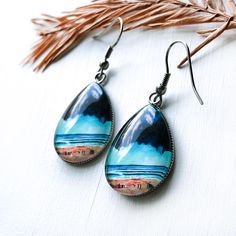 *These fun earrings feature a print of one of my original paintings glazed under glass. *Choose between three teardrop sizes: Large, Medium and Small (see third picture for size reference). *Both the ear-wire and the bezel are stainless steel. Artistic Teardrop Earrings As Gift, Artistic Teardrop Earrings For Gift, Artistic Teardrop Earrings, Artistic Teardrop Earrings With Artistic Design, Nickel-free Teardrop Artsy Earrings, Large Earrings, Stainless Steel Earrings, Ear Wire, Fun Earrings