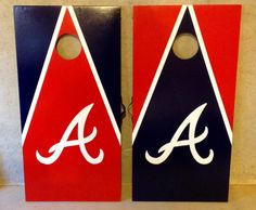 two red, white and blue cornhole game boards with the letter a on them