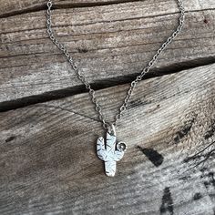 "This Tiny Saguaro pendant symbolizes strength, endurance, and someone who can bounce back from the toughest of times. This dainty cactus is made from solid sterling silver and is then hand-stamped and includes the perfect sterling silver flowering bloom. The Tiny Saguaro pendant measures only 0.75\" high and 0.5\" wide. Perfect piece for everyday wear. The Tiny Saguaro pendant is shown on an 18\" oxidized cable chain or can be purchased as a pendant only.  **Pendant is shown next to a Buffalo n Nickel-free Southwestern Style Necklace As Gift, Southwestern Style Nickel-free Necklace For Gift, Flowering Cactus, Cactus Necklace, Jewelry Western, Faith Jewelry, Saguaro Cactus, Bounce Back, Necklace Sterling Silver