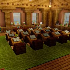 a room filled with lots of tables and chairs next to a green rug on top of a wooden floor