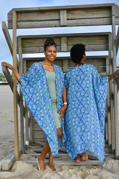 Luxurious and lightweight, soft and shear, wear it as a beach coverup. With the self tie belt, it doubles as an easy wrap dress, perfect for sunset cocktails. Dress it up with jeans and boots or let it hang as a luxurious duster for when you snuggle up on the couch. Feel gorgeous on all occasions. Rayon Kimono For Loungewear, Rayon Dresses With Kimono Sleeves, Fitted Maxi Length Kimono, Blue Flowy Wrap Dress, Flowy Beach Dress With Kimono Sleeves, Flowy Loungewear Dresses, Daywear Kimono With Kimono Sleeves For Beach, Beachwear Kimono With Kimono Sleeves For Daywear, Flowy Kimono For Daywear