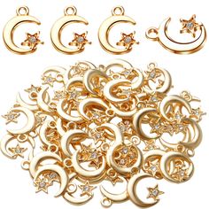 a bunch of gold colored metal items on a white background with stars and swirls