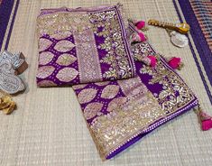 A Lovely Purple Pink Banarasi Georgette Bandhani Gota Patti Saree in Gharchola Pattern. The saree is adorned with intricate gota patti handwork which makes it all the more a perfect choice for occasion wear. Its a fusion of karigari from Banaras, Gujarat and Rajasthan. We must say, a truely heirloom piece. The zari work on the saree is done in Banaras and then the Bandhej is tye and dyed in Gujarat. Then the karigars of Rajasthan have worked their magic with the gota embroidery. So its takes abo Traditional Purple Sharara With Dori Work, Purple Art Silk Traditional Wear With Gota Work, Purple Traditional Drape With Gota Work, Traditional Purple Sharara With Gota Work, Transitional Dola Silk Saree With Gota Work, Purple Traditional Wear With Dori Work, Traditional Purple Wear With Dori Work, Purple Traditional Wear With Dori Work For Festivals, Traditional Purple Dupatta With Dori Work