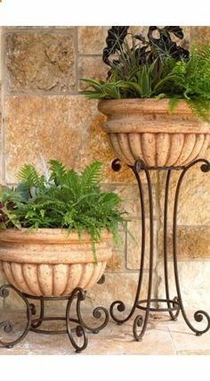 two large planters with plants in them