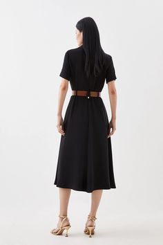 An ode to sophistication and timeless design, soft tailoring immerses this dress with short sleeves, a notched collar and waist belt adding touches of refinement above and a graceful skirt that flows to a midaxi hemline below. Perfect for emanating poise at professional events and special occasions alike.Soft TailoringShort SleevedNotched collar and waist belt Classic Belted Shirt Dress For Semi-formal Occasions, Classic Short Sleeve Belted Midi Dress, Short Sleeve Belted Midi Dress For Casual Wear, Casual Belted Short Sleeve Midi Dress, Belted Midi Dress With Short Sleeves For Casual Wear, Black Belted Midi Dress For Semi-formal Occasions, Casual Belted Midi Dress With Short Sleeves, Belted Short Sleeve Midi Dress For Evening, Fitted Collared Semi-formal Belted Dress