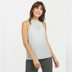 Crafted From 80% Nylon And 20% Lycra, This Oversized Tank Is Machine Washable, Making It A Practical And Stylish Addition To Your Wardrobe. The "Go Lightly" Style Adds A Touch Of Elegance, While The Ribbed Pattern And Basic Style Make It A Must-Have For Any Wardrobe. Whether You're Dressing Up For A Night Out Or Keeping It Casual, This Spanx Tank Is Sure To Be A Staple In Your Closet. Nwt Never Worn Had A Small Light Blemish On Front. May Be Able To Be Washed Out. See All Photos. Otherwise In Gr Compression Tank Top, Teal Tank Top, Mock Neck Tank, Workout Wardrobe, Ribbed Tank Top, Black Camis, Ribbed Tank Tops, Ribbed Tank, Lace Tank Top