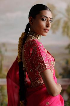 Hot pink saree with antique gold dori, sequin, bead, cutdana embroidery in floral pattern. Paired with petticoat and half sleeve padded blouse.
Components: 3
Pattern: Embroidery
Type Of Work: Dori, sequin, bead, cutdana
Neckline: Leaf neck
Sleeve Type: Half sleeves
Fabric: Organza, Raw Silk, Lining: Shantoon
Color: Pink
Other Details: 
Scallop border
Back tassel tie-up
Approx. product weight: 2-3 kgs 
Note: Outfit worn by the model on left is not for sale
Occasion: Reception - Aza Fashions Ceremonial Pre-draped Saree With Cutdana, Festive Ceremonial Pre-draped Saree With Cutdana, Elegant Traditional Drape Blouse For Ceremonies, Ceremonial Blouse With Cutdana In Traditional Drape, Gold Dola Silk Blouse Piece For Traditional Ceremonies, Ceremonial Blouse Piece With Zari Work For Transitional Season, Ceremonial Transitional Blouse Piece With Zari Work, Bollywood Style Ceremonial Blouse Piece With Traditional Drape, Ceremonial Blouse Piece For Diwali With Traditional Drape