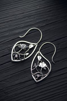 Flower hoop earrings Magnolia blossom jewelry Botanical | Etsy Unique Flower-shaped Pierced Earrings, Handmade Silver Botanical Earrings, Artistic Flower-shaped Earrings With Ear Wire, Artistic Flower Shaped Ear Wire Jewelry, Nature-inspired Drop Flower Earrings For Pierced Ears, Nature-inspired Silver Flower Drop Earrings, Nickel Free Nature-inspired Flower Earrings, Nature-inspired Flower Shaped Ear Wire Jewelry, Nature-inspired Flower Shape Jewelry With Ear Wire