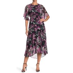 New With Tag Taylor Dresses Floral Print Dress Color: Multi (Black And Purple) Size: 12 Approx Measurements Laying Flat Armpit To Armpit: 19” Waist: 16” Front Length: 48” Back Length: 55” Sleeve Length: 17” (At Longest Spot) Floral Print Jewel Neck Short Sleeves Back Zip Closure Allover Floral Print P8-21 4-22 1 Sh. Purple Short Sleeve Midi Dress With Ruffles, Purple Midi Dress With Short Sleeves And Ruffles, Flowy Ruffle Dress, Black Ruffled Dress, Faux Skirt, Cold Shoulder Sweater Dress, Funky Dresses, Lace Trim Blouse, Purple Floral Print