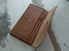 Vintage brown genuine leather wallet - Natural leather wallet - Genuine leather wallet - Vintage Bulgaria handmade wallet Vintage Bulgaria handmade genuine leather wallet . Made of genuine leather . In good vintage condition. Measures : For other VINTAGE BAG OR WALLET please check here : https://www.etsy.com/shop/TheVINTAGEShopBG?ref=seller-platform-mcnav&section_id=22456024 FAST SHIPPING ! Possible express delivery with DHL but please first ask me for price . All pictures are real . You buy Vintage Handmade Trifold Wallet For Everyday, Handmade Vintage Wallet, Handmade Vintage Wallets For Everyday Use, Vintage Leather Trifold Wallet For Everyday, Vintage Leather Trifold Wallet For Daily Use, Vintage Handmade Wallets For Daily Use, Vintage Leather Card Holder For Everyday Use, Vintage Leather Trifold Wallet Gift, Vintage Leather Card Holder