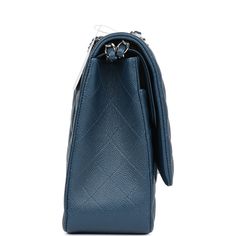 This Maxi Classic Double Flap bag is in dark blue caviar leather with silver hardware and features a front flap with signature CC turnlock closure, half moon back pocket, and adjustable interwoven silver tone chain link and dark blue leather shoulder strap.The interior is lined in dark blue leather with a "love letter" zipper compartment under the first flap, an "outer" slit pocket under the second flap, and an interior compartment with two open pockets separated by a "lipstick" compartment.Collection: 15C (2014)Origin: FranceCondition: Never Accompanied by: Chanel box, Chanel dustbag, COA card, carebook, retail UPC, feltMeasurements: 13" width x 8.5" height x 4" depth; 19" strap drop (10.5" doubled)