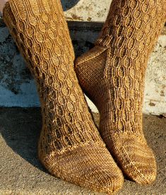 A top-down unisex sock in four sizes with an unusual rib running down the leg and over the top of the foot. The pattern of twist stitches opens to reveal cozy cocoon shapes that provide warmth and a snug fit. Pattern is easily reversed for toe-up construction. Shown here in Socks that Rock Lightweight, color Muddy Bottom BreakdownSuggested Yarns: Better Breakfast Fingering, Modern Deco Sport, or any springy, high-twist sock yarn. Substituting yarn and/or needles may result in an overall variatio Cable Socks, Knitting Notions, Art Socks, Hand Knit Socks, Socks Pattern, Knitting Blogs, Sock Knitting Patterns, Knitting Magazine, Pattern Store