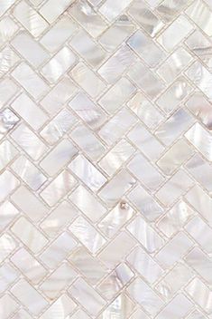 an image of a white mosaic tile pattern that looks like it is made from mother of pearl