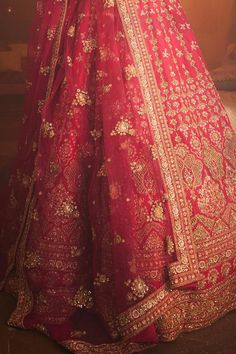 Rani attached cancan lehenga with zardozi, thread, sequin embroidery in floral pattern. Paired with sweetheart neck padded blouse and embroidered dupatta.
Components: 3
Pattern: Embroidery
Type Of Work: Zardozi, cutdana, sequin, thread
Neckline: Sweetheart neck
Sleeve Type: Half sleeves
Fabric: Raw Silk
Color: Pink
Other Details: 
Lehenga:
Attached cancan
Floral pattern
Length: Approx 43 - 44 inches
Blouse:
Padded
Dupatta:
Embroidered borders
Semi sheer
Occasion: Bride - Aza Fashions Semi-stitched Anarkali Lehenga With Tilla Details, Anarkali Semi-stitched Lehenga With Tilla Embroidery, Anarkali Semi-stitched Lehenga With Tilla Details, Anarkali Style Semi-stitched Lehenga With Tilla, Red Tilla Lehenga For Festive Occasion, Semi-stitched Floor-length Tilla Sharara, Red Tilla Choli For Wedding, Red Choli With Tilla For Wedding, Traditional Semi-stitched Tilla Dress