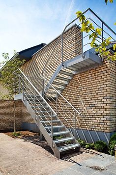 a brick building with stairs leading up to it