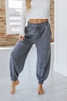 Elevate your wardrobe with our Harvey Lace-up Waist Harem Pants! Crafted with a unique lace-up waist design, these pants not only provide a stylish touch but also offer a comfortable fit. Perfect for any occasion, our harem pants will make you stand out from the crowd. Upgrade your style today! Model Info: Models are 5'7", Size 2, wearing smalls Material: 65% Polyester + 35% Cotton Sizes Trousers_Waist Hip Bottoms Inseam Outseam Relax Relax Relax Relax Relax S 25.6 44.9 27.8 26.7 39.8 M 27.6 47. High Waist Relaxed Fit Bottoms With Drawstring, High Waist Drawstring Sweatpants For Leisure, Trendy Drawstring Bottoms For Loungewear, Trendy Gray Pants With Drawstring, High Waist Joggers With Drawstring In Relaxed Fit, Trendy High Waist Drawstring Sweatpants, High Waist Drawstring Athleisure Pants, High Waist Drawstring Leisure Pants, Trendy High Waist Sweatpants With Drawstring