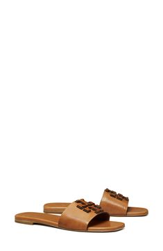 Dimensional logo detailing stands out atop the vamp of this laid-back leather slide sandal. Leather upper, lining and sole Imported The Vamp, Leather Slide Sandals, Leather Slides, The Vamps, Sandal Women, Curator Style, Slide Sandals, Women's Shoes Sandals, Tory Burch