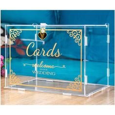 a clear acrylic box with the words cards welcome to our wedding