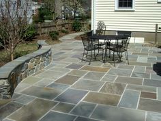 an outdoor patio with tables and chairs